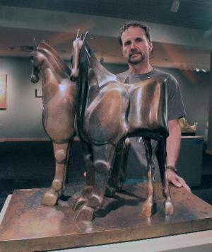 Image of Jözef with his Sculpture Narrow Horses 2