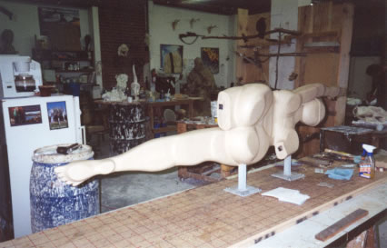 Working clay sculpture of, "Swimmer", Loveland, Colorado.