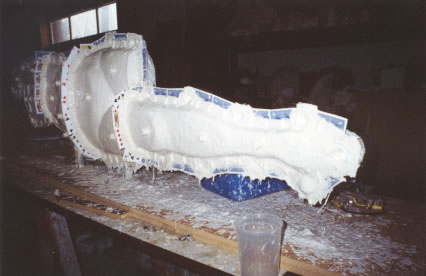 Plaster is applied over the rubber coating for support and tabs lock the rubber in place.